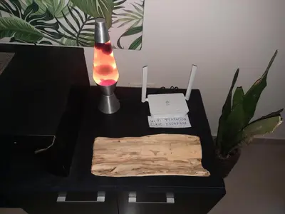 a black table with a lamp and a wooden cutting board at Terra Zion in Cordoba