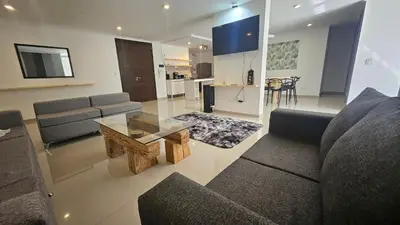 a living room with a couch and a coffee table at Semipiso CALAZANS in Cordoba