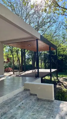 a wooden pavilion with stairs in a park at Rocio del Champaqui in Santa Rosa de Calamuchita