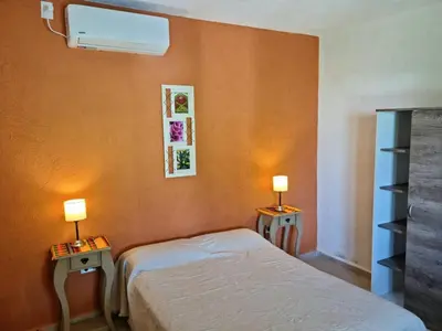 a bedroom with a bed and two tables with lamps at Finca La Linda in San Javier