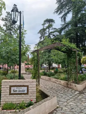 a sign in a park with a fountain and a street light at Finca La Linda in San Javier