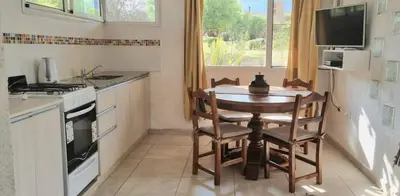 a kitchen with a table and chairs and a stove at Finca La Linda in San Javier