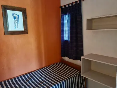 a small room with a bed and a window at Finca La Linda in San Javier