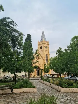 a church with a clock tower in a park at Finca La Linda in San Javier