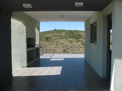 a hallway of a house with a view of a mountain at Balcones de Los Chorrillos in Estancia Vieja