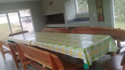 a dining room table with a checkered table cloth on it at Balcones de Los Chorrillos in Estancia Vieja