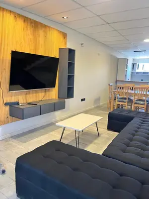 a living room with a large flat screen tv on a wall at Único y hermoso in Cordoba
