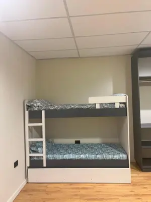 two bunk beds in a room with a ceiling at Único y hermoso in Cordoba