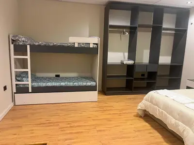 a bedroom with two bunk beds and a bed at Único y hermoso in Cordoba