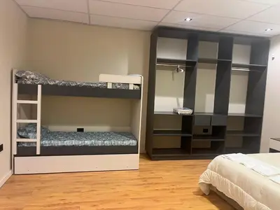 a room with two bunk beds and a bed at Único y hermoso in Cordoba