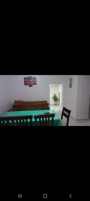 a room with a table and two chairs and a table and a table and chairs at La casita in Villa Carlos Paz