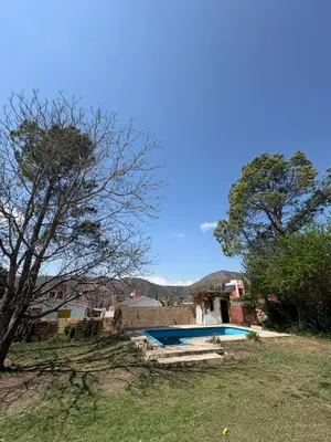 a house with a swimming pool in a yard at Casa La Tranquilidad in La Porteña