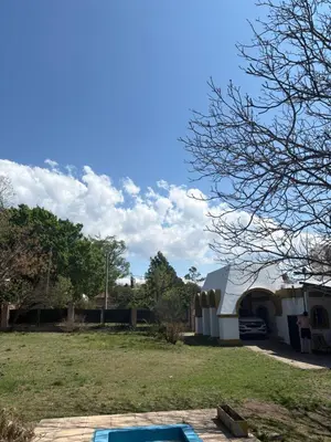 a view of a yard with a building at Casa La Tranquilidad in La Porteña