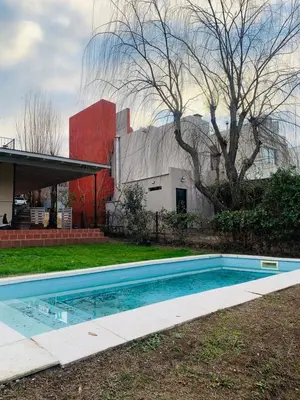 a swimming pool in the yard of a house at La Estanzuela FM in La Calera