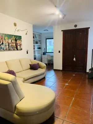 a living room with two couches at La Estanzuela FM in La Calera