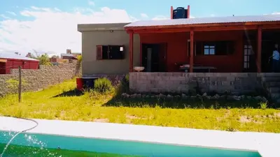 a house with a pool in front of it at Casa Tanti in Tanti