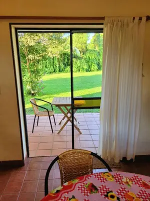 a view of a patio with a table and chairs at Cabañas El Paso in Villa del Dique