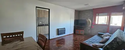 a living room with a couch and a table at Dpto temporario Cba in Cordoba