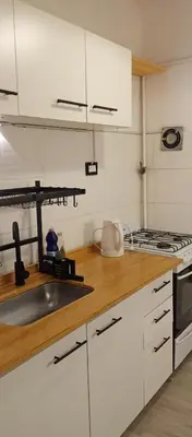 a kitchen with a sink and a stove at Depto Privado Quality in Cordoba