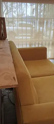 a couch in a living room with a window at Depto Privado Quality in Cordoba