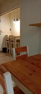 a dining room with a wooden table and chairs at Depto Privado Quality in Cordoba