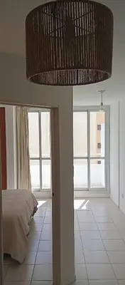 a bedroom with a bed and a large ceiling at Sol de Alberdi in Cordoba