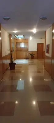 a large hallway with a large room with wooden walls at Sol de Alberdi in Cordoba