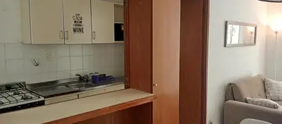 a small kitchen with a sink and a stove at Sol de Alberdi in Cordoba