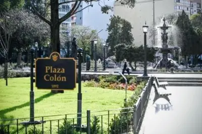 a sign that says pizza coliseum in a park at Sol de Alberdi in Cordoba
