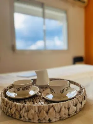 two cups and saucers on a tray on a table at Carlos Paz Tupungato in Villa Carlos Paz