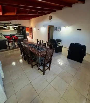 a dining room with a table and some chairs at Casita serrana in Villa Santa Cruz del Lago