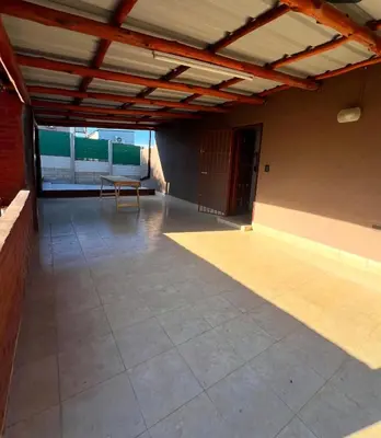 an empty room with a table and a bench at Casita serrana in Villa Santa Cruz del Lago