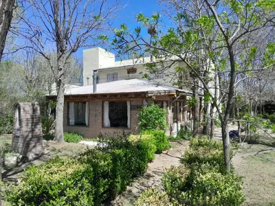 an old house with trees in front of it at Rafael Arcangel in Nono