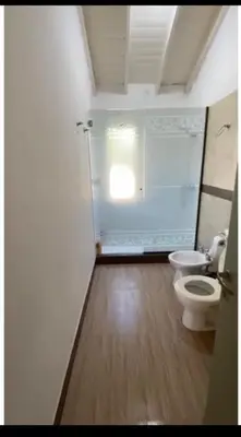 a bathroom with a toilet and a window in it at Alojamiento Mabel in Merlo
