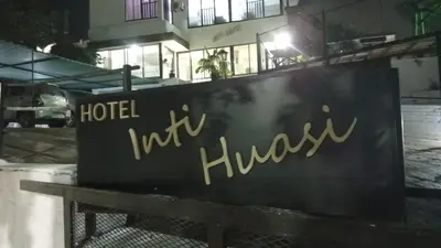 a sign in front of a hotel in a building at Hotel inti huasi in Villa Carlos Paz