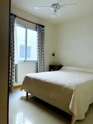 a bedroom with a bed and a window at DPto Carlos Paz in Villa Carlos Paz