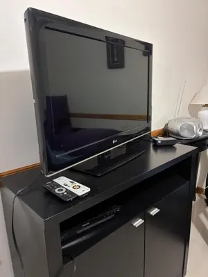a flat screen tv sitting on top of a table at DPto Carlos Paz in Villa Carlos Paz