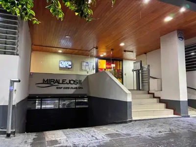 a building with a staircase in front of a building at DPto Carlos Paz in Villa Carlos Paz