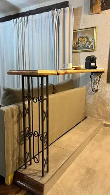 a wooden table in a room with a couch at Terrazas Suite in Potrero de Garay