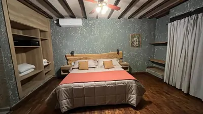 a bedroom with a bed and a ceiling fan at Terrazas Suite in Potrero de Garay