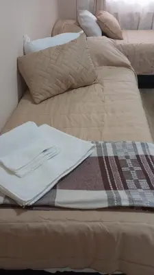 two beds sitting next to each other in a room at Monoambiente Villa Carlos Paz Centro, Terminal in Cordoba