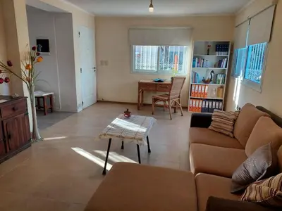 a living room with a couch and a table at Casa en Villa General Belgrano in Villa General Belgrano