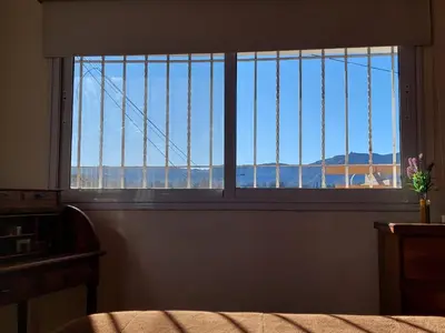 a window in a room with a view of the mountains at Casa en Villa General Belgrano in Villa General Belgrano