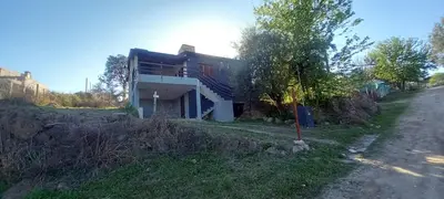 a house on the side of a road at Cabaña Cerca del rio Cabalango in Cavalango