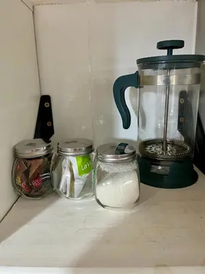 a blender sitting on a counter next to jars at Dulce de Córdoba in Cordoba