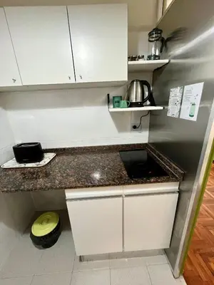a kitchen with white cabinets and a counter top at Dulce de Córdoba in Cordoba