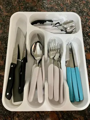 a plastic tray with utensils in a drawer at Dulce de Córdoba in Cordoba