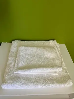 a white towel sitting on top of a table at Dulce de Córdoba in Cordoba