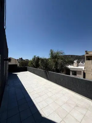 a walkway on top of a building at Puntasol vcpaz in Villa Carlos Paz
