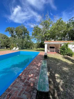 a villa with a swimming pool and a house at Casa Paine in San Javier